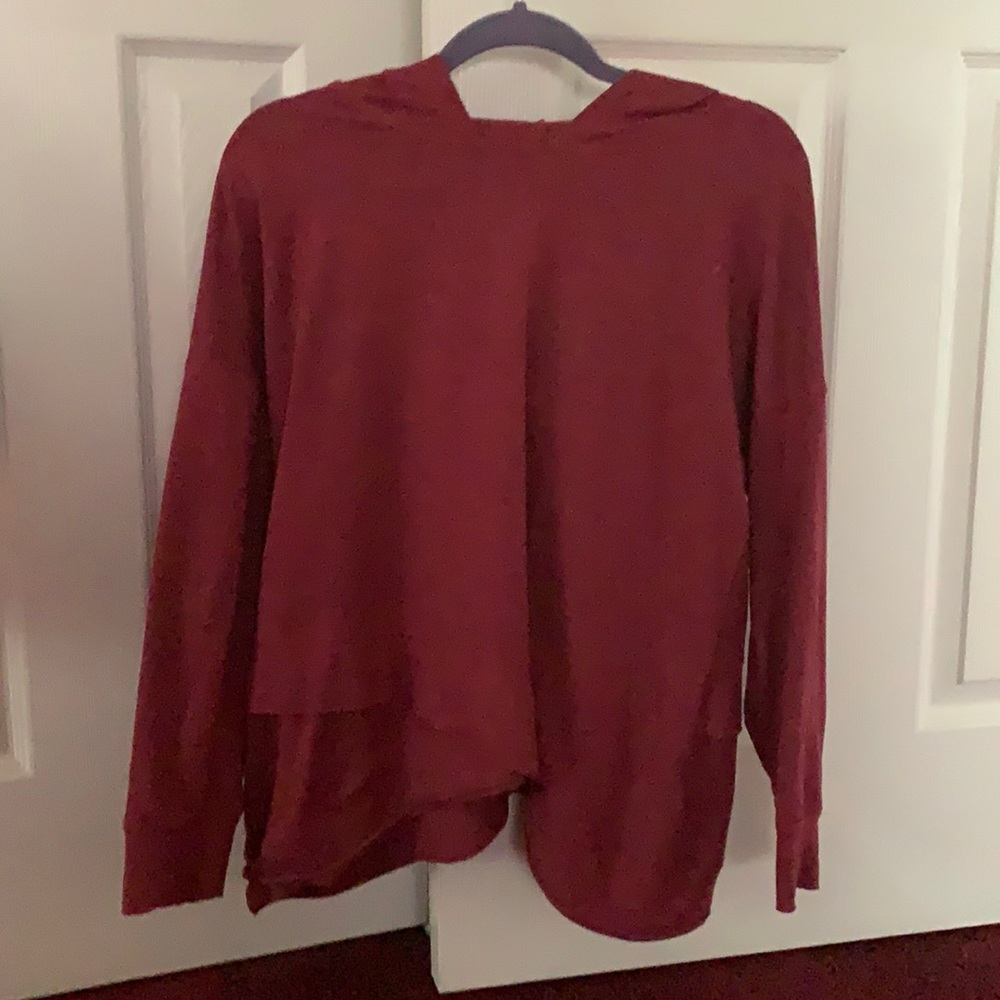Red,light weight hoodie with a criss-cross bottom